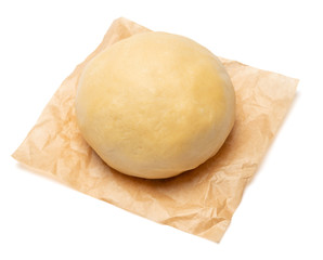 unrolled and unbaked Shortcrust pastry dough on white background