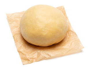 unrolled and unbaked Shortcrust pastry dough on white background