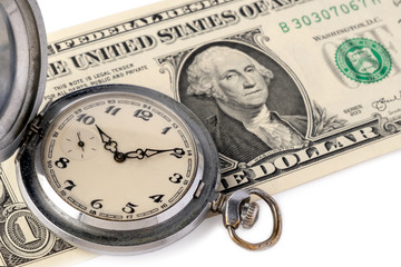 Close-up of an old pocket watch with scratches lie on a one-dollar bill of the USA with a portrait of Washington. The concept of time is money and effective time management. Advertising watchmaking.