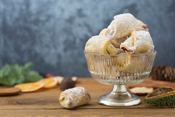 Homemade biscuits or cookies filed with jam, and Christmas spices. Wooden table. Desserts and sweets.