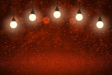 Obraz na płótnie Canvas red fantastic glossy glitter lights defocused light bulbs bokeh abstract background with sparks fly, celebratory mockup texture with blank space for your content