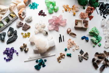 Collection of beautiful precious stones on white table.