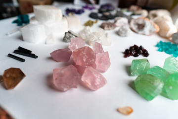 Collection of beautiful precious stones on white table.