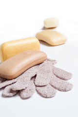 high-grade natural aroma soaps with washing mitten at wite background