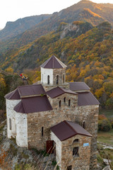 old monastery in the mountains in autumn