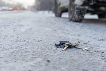 Lost a bunch of keys lying on the side of the road in the winter on the snow, near the roadway