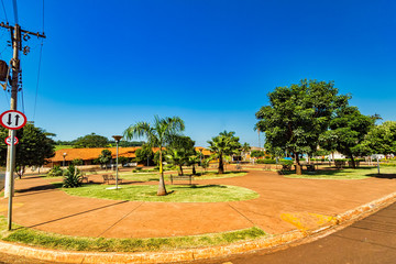 Obraz premium Square with trees in sunny day in the city of Dumont in the interior of Sao Paulo, Brazil