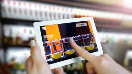 Customer use AR application to order drink at the bar, Hand touching interface