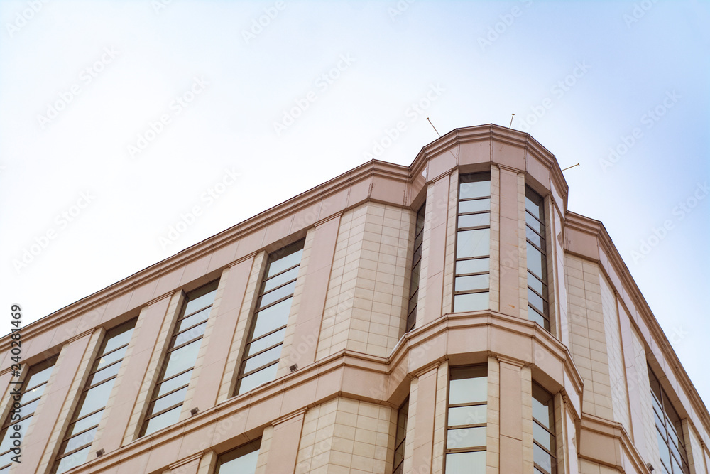 Wall mural The facade of a modern building on the background of a winter sky