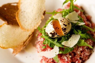 beef tartare with quail egg