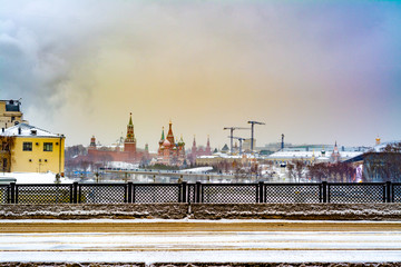 Fototapeta na wymiar View of the city of Moscow with the red square towers and construction cranes