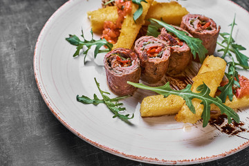Traditional russian or moldavian or romanian or ukrainian food called mamaliga.Italian traditional Polenta, porridge made from cornmeal.