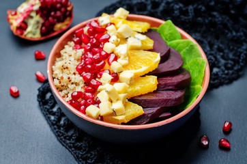 Quinoa spinach beet orange pomegranate blue cheese salad
