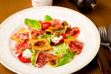 jamon prosciutto with fig quail poached egg and dried olives