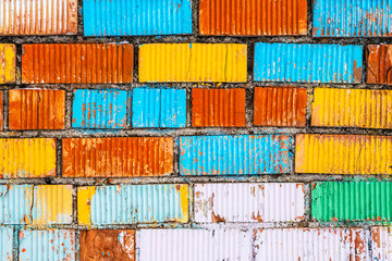 Old wall multicolor. Bricks painted in a different bright color.