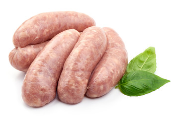 Sausages For Frying with basil leaf, close-up, isolated on white background