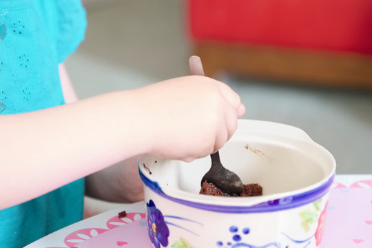 Child Eating Sweets Pudding Desert Chocolate Cake Young Kid Girl With Spoon And Dish Unhealthy