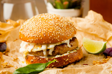 hamburger with chicken chop and poached egg cheese sauce