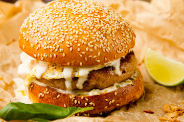 hamburger with chicken chop and poached egg cheese sauce