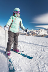 Kids ski lesson in alpine school. Little skier posing