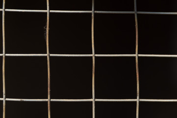 Naklejka premium mesh fence background on black background