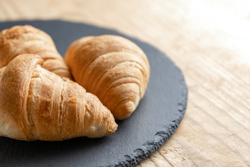 Croissants on the Board slate. copy space