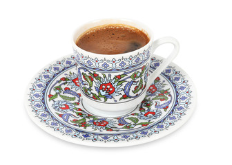 Turkish coffee in traditional porcelain cup on isolated white background