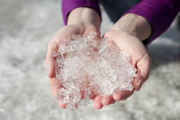 Beautiful women's pens hold cold snow ice in their palms