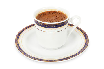 Turkish coffee in traditional porcelain cup on isolated white background