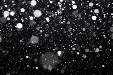 Snowfall on black background