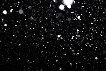 Snowfall on black background