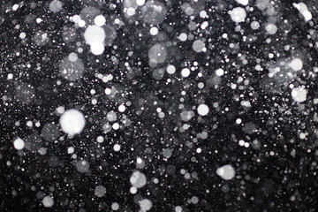 Snowfall on black background