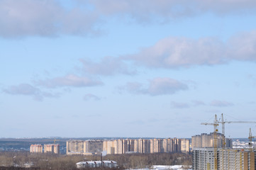 view of houses under construction in winter