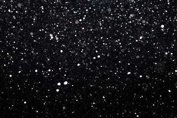 Snowfall on black background