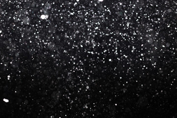 Snowfall on black background