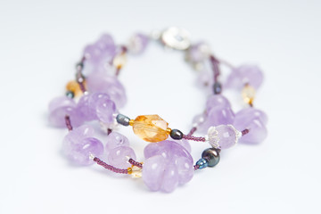 blue necklace on white