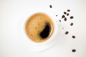 Coffee espresso. Coffee cup and coffee beans on white background closeup. Breakfast, morning, energy concept. Top view