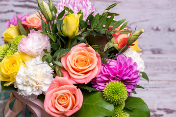 beautiful floral arrangement in the box, pink and yellow rose, pink eustoma, green and pink...