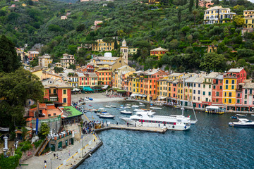 beach streets and colorful houses on the hill in Portofino in Liguria in Italy 