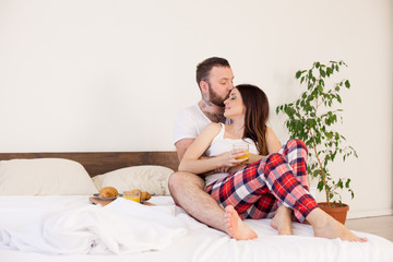 husband and wife morning breakfast in bed in the bedroom the family love