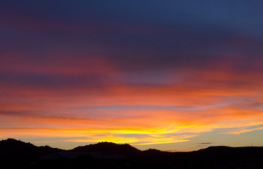 Brilliant pink sunset over the mountains in San Diego California