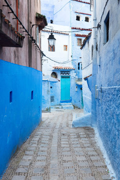 blue street and emerald door in blue city Chefchaouen in Morocco