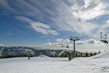 Famous ski resort in Czech Rupublic - Spindleruv Mlyn. People on mountain , the chairlift .