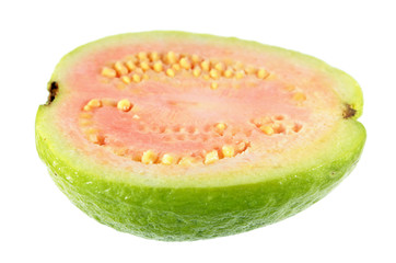 Ripe pink apple guava (Psidium guajava) fruit cut in half lengthwise isolated on white background