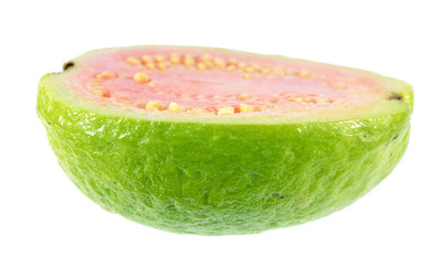 Ripe pink apple guava (Psidium guajava) fruit cut in half lengthwise isolated on white background