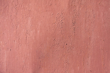 Metal texture background with pale red worn paint