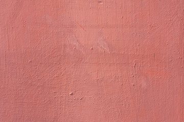 Metal texture background with pale red worn paint