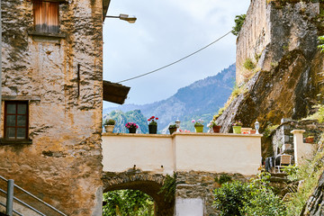 Flower pots in the antique surroundings of Corsica old town od Corte