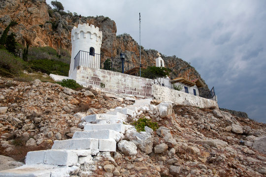 Little church on rocky seashore near Karathonas beach. Church Agios Nikolaos, Nafplio, Argolida, Peloponnese, Greece - Immagine