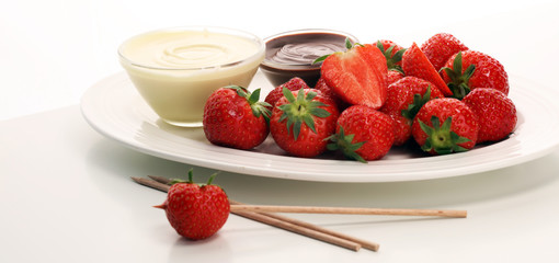 Fondue with Melting chocolate or melted chocolate and strawberry.
